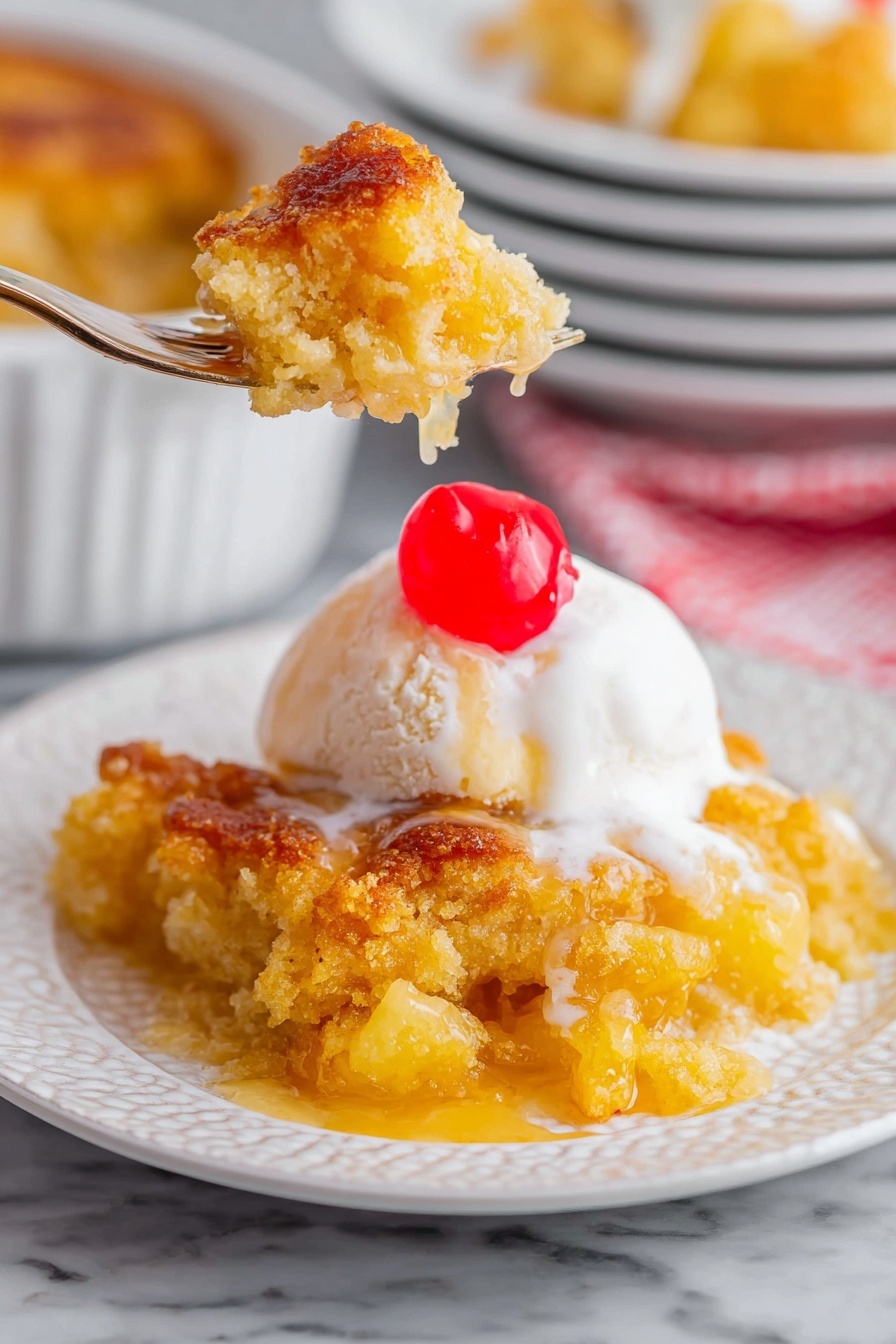 A white textured plate holds a warm yellow cobbler with a crispy golden-brown crust that looks soft and juicy inside. On top of the cobbler, there is a scoop of white melting ice cream with a shiny red maraschino cherry sitting on it. A fork lifts a piece of the cobbler and ice cream, showing the soft texture and some creamy sauce dripping off. The background is a white marbled surface with a stack of white plates and a blurred matching cobbler in the back. Photo taken with an iphone --ar 2:3 --v 7