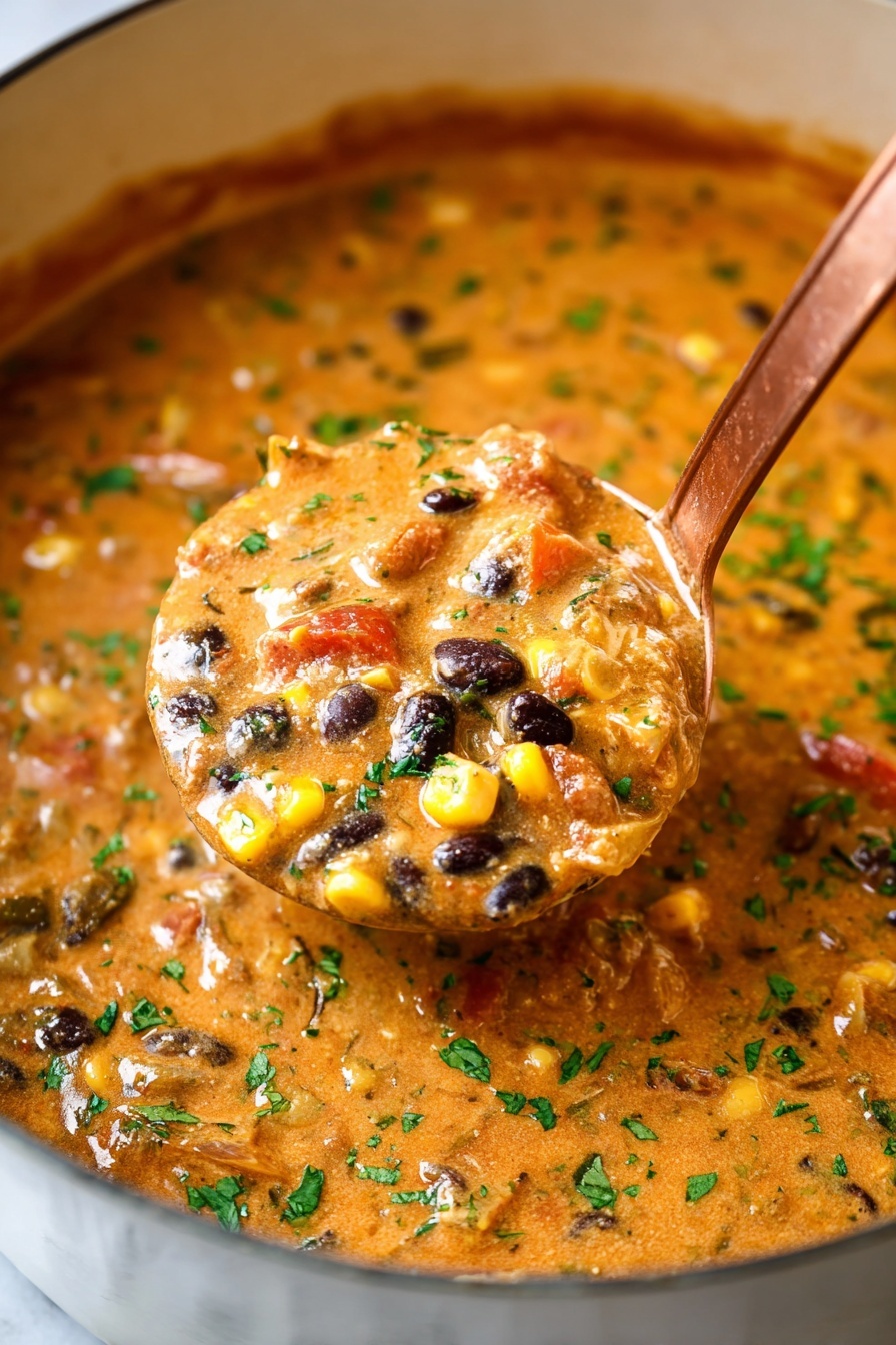 A large white pot holds a thick stew with a creamy, orange-brown base mixed with colorful ingredients like yellow corn, black beans, and small red and green bits that look like peppers and herbs. The stew has green chopped herbs sprinkled on top, giving a fresh look. A shiny metal ladle scoops a portion of the stew, showing the chunky texture with all the mixed vegetables and beans. The pot sits on a white marbled surface, and in the background, there are blurred bowls of green sliced jalapeños and yellow tortilla chips. A woman's hand holds the ladle, dipping it into the stew photo taken with an iphone --ar 2:3 --v 7