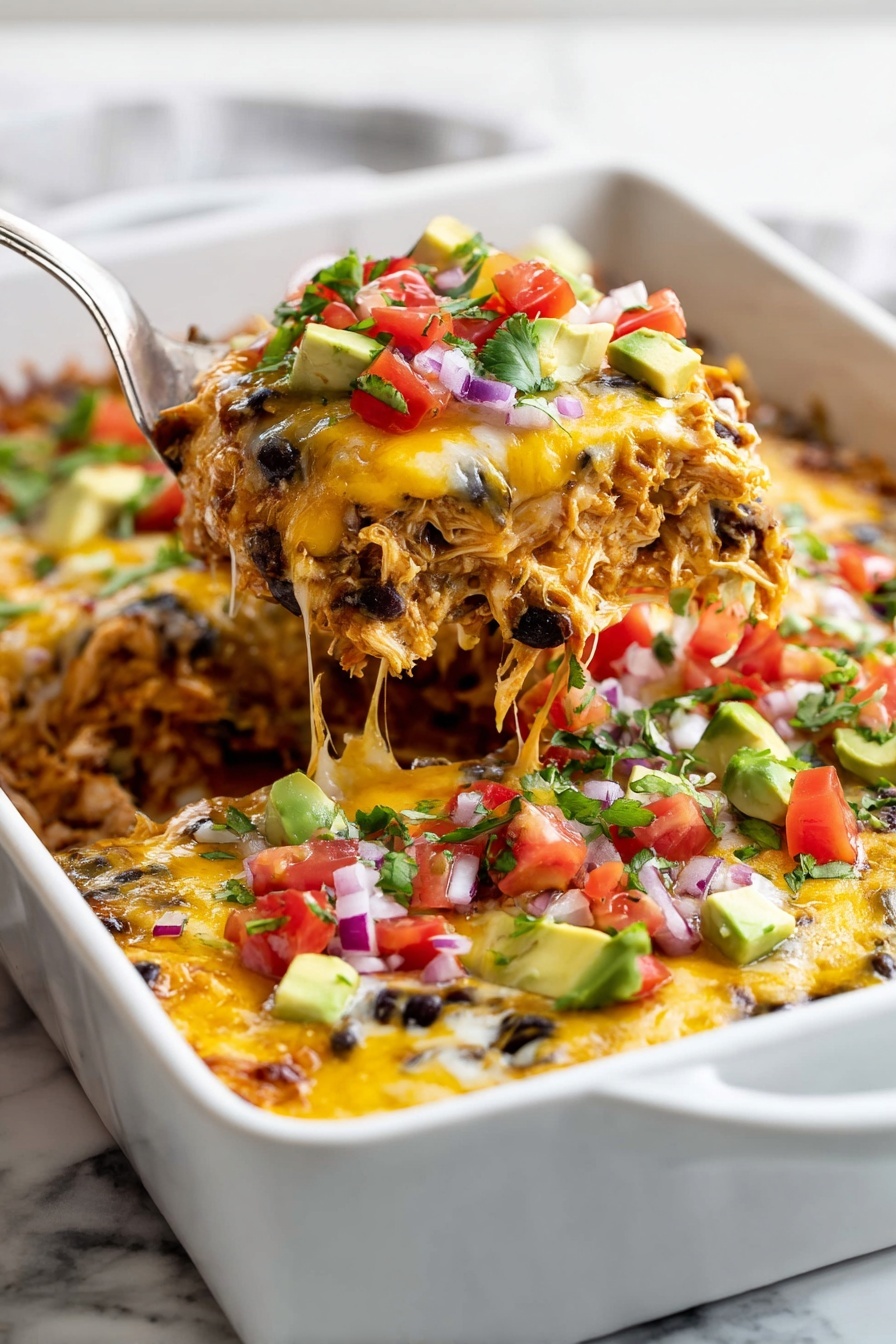 The dish is a layered casserole in a white rectangular baking dish, filled with shredded chicken mixed with black beans and melted yellow cheese as the base layer. On top, there are small diced pieces of red tomatoes, green jalapeno peppers, avocado chunks, and finely chopped purple onions scattered across the surface. The melted cheese stretches slightly as a metal spatula lifts a serving from the dish, showing a close-up of the colorful mix. The whole scene sits on a white marbled surface. Photo taken with an iphone --ar 2:3 --v 7