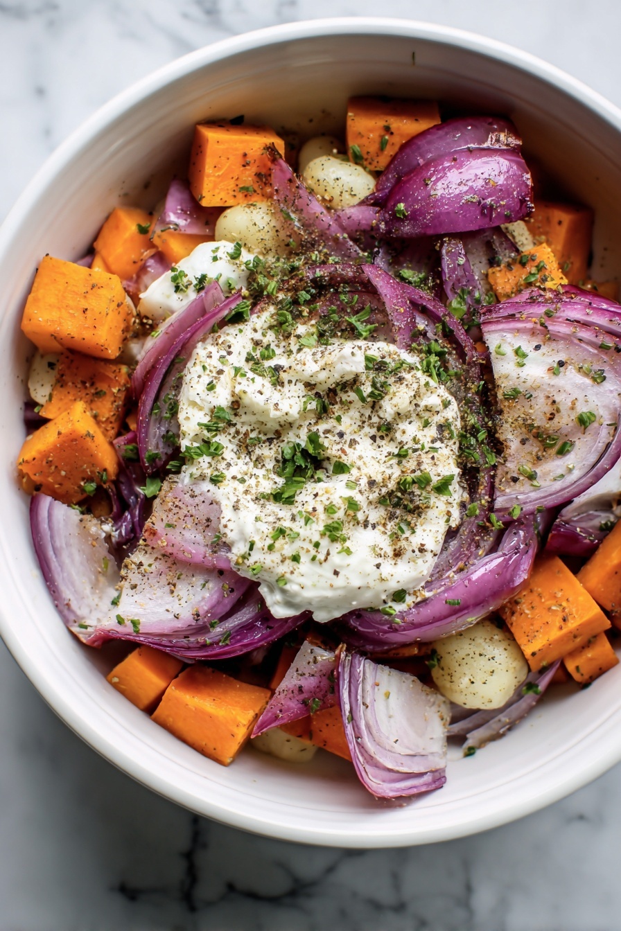 A yellow bowl filled with a mix of roasted gnocchi, bright orange sweet potato cubes, green kale leaves, purple-red onion slices, and browned chicken pieces, all seasoned with herbs and black pepper flakes. The gnocchi are round and golden, the kale is wilted but still vibrant, and the chicken is browned with a crispy texture. There is a gold fork with a white handle resting inside the bowl. The bowl is set on a white marbled surface, with a colorful saucer and glass of amber liquid visible in the top left corner. photo taken with an iphone --ar 2:3 --v 7